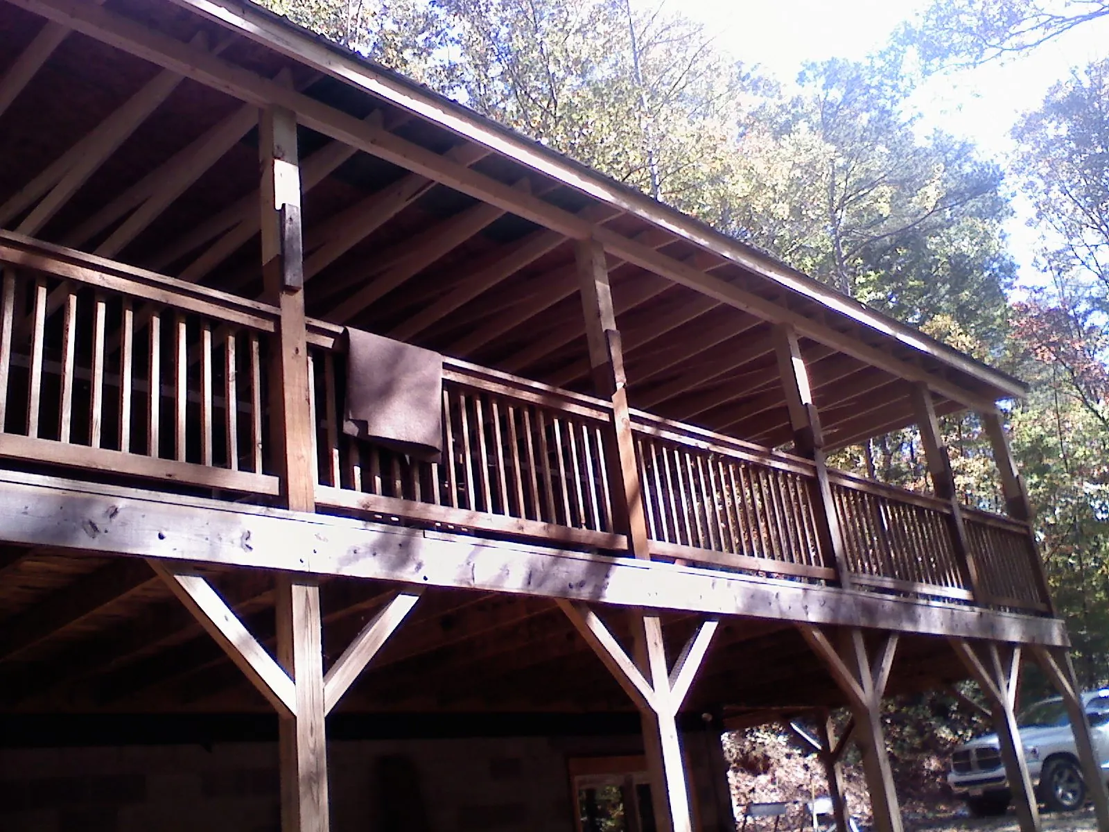 Timber framing under a new elevated porch and deck — Roof Leak Repair in Groton by Roofing Brothers